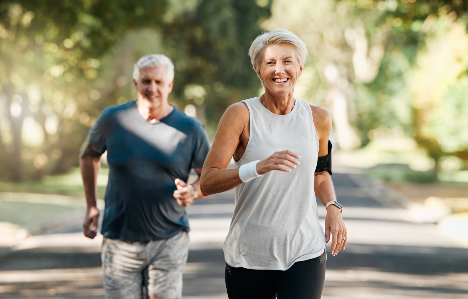 Older couple running together