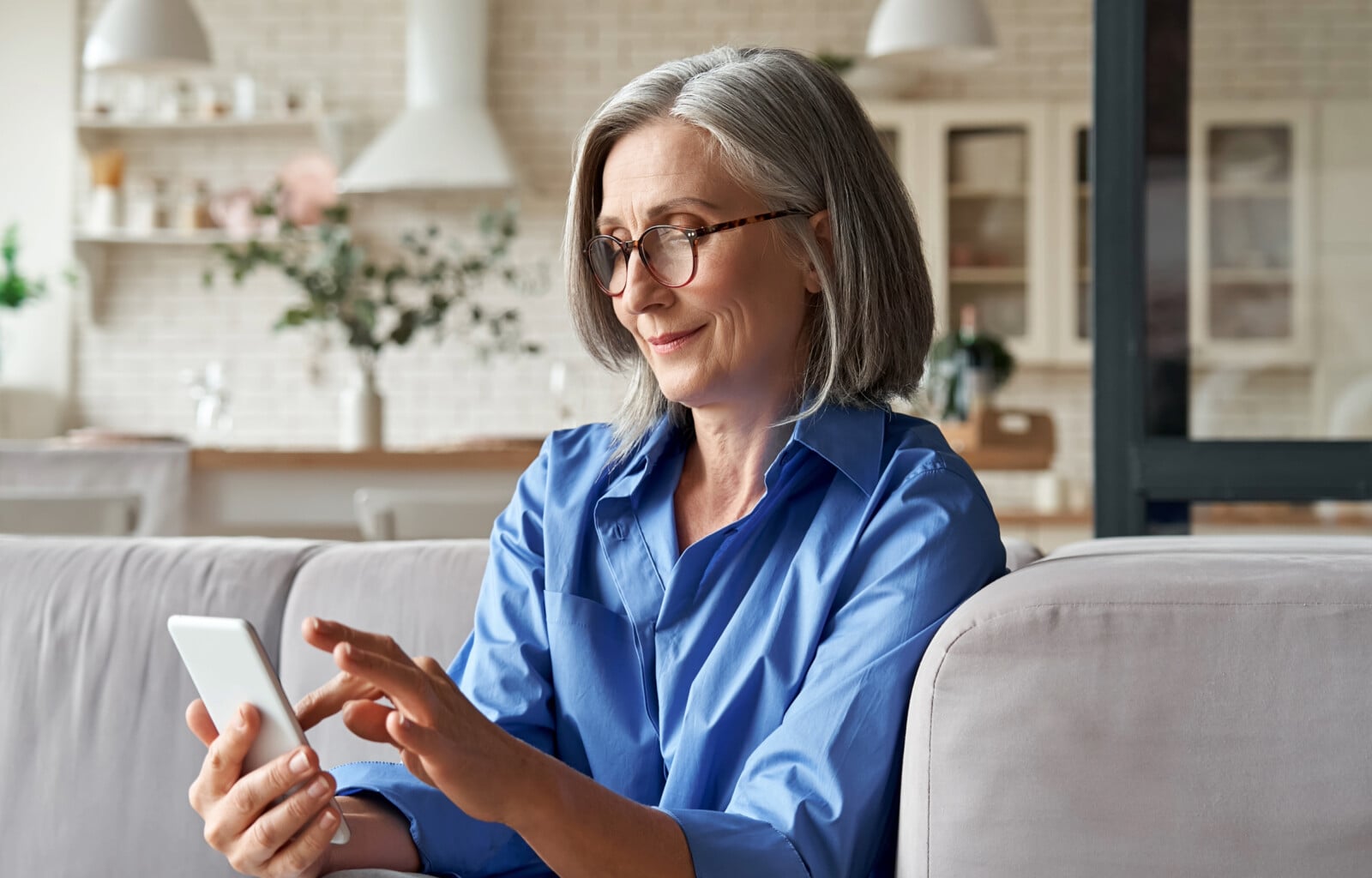 older women looking at her phone