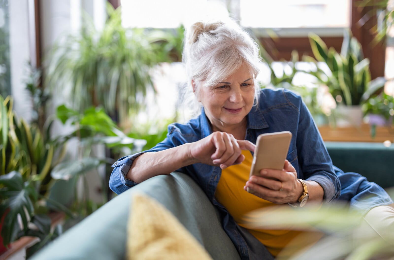 Elderly women looking at cell phone
