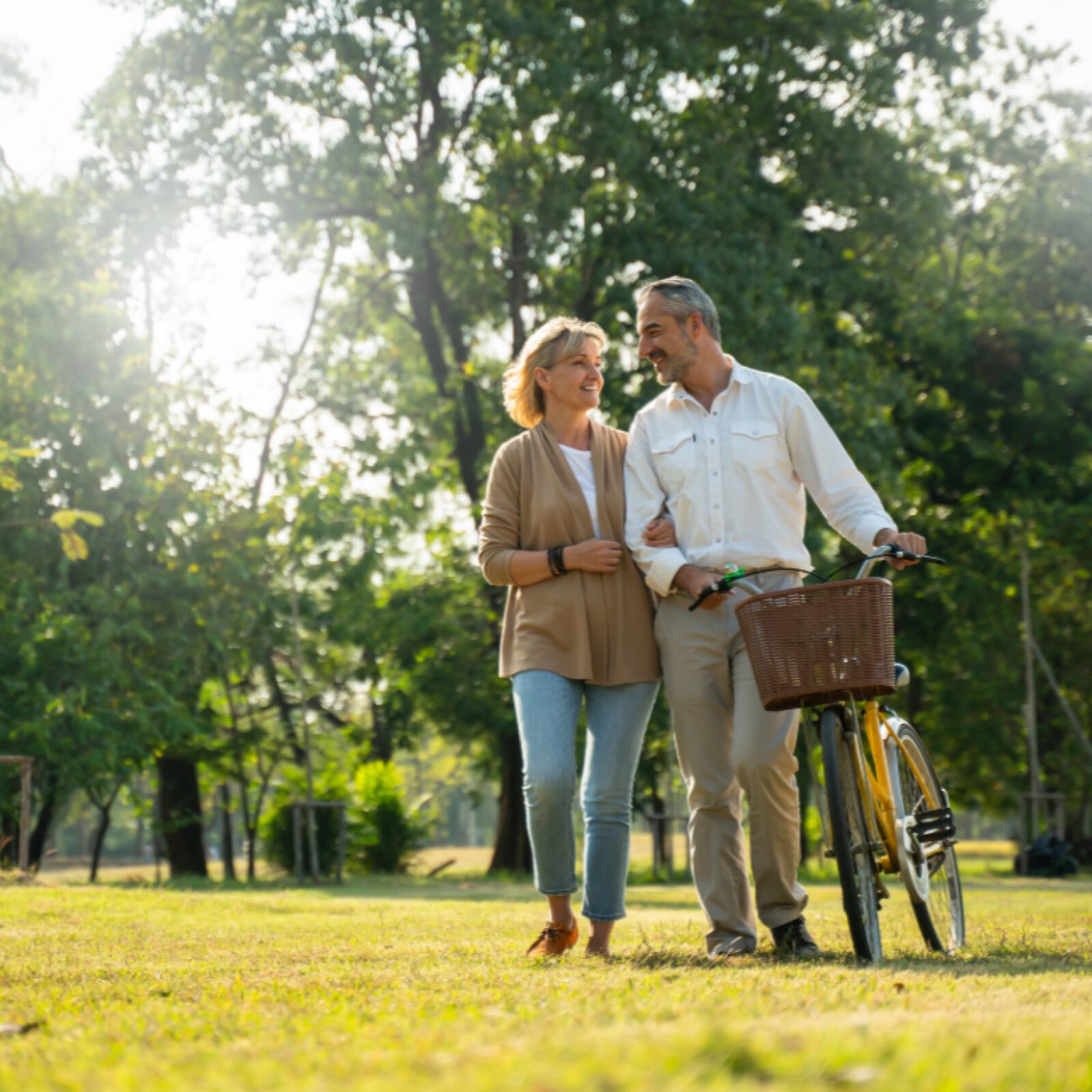 couple happily walking together in a field
