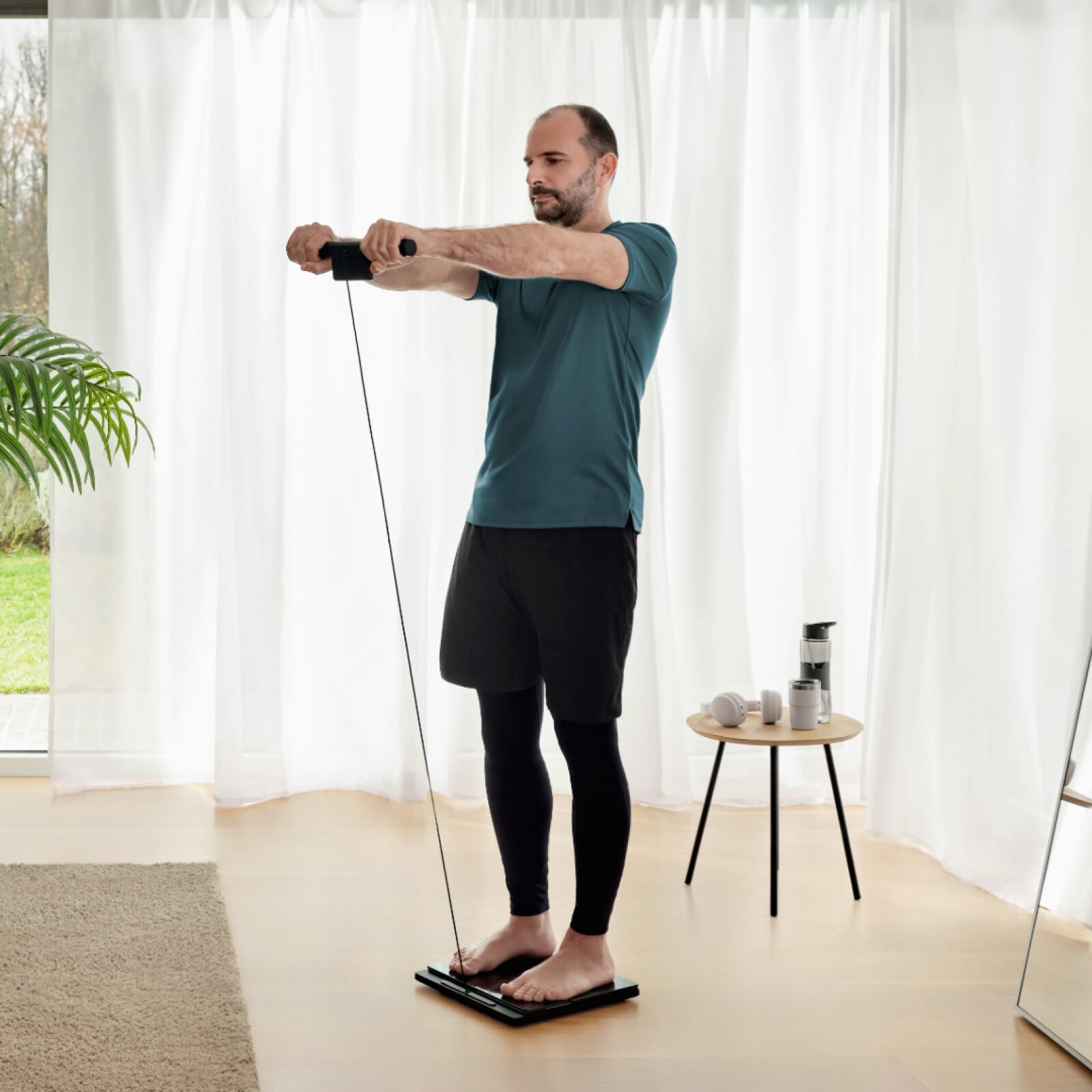 Man standing on the scale + Body composition monitor with handlebar up