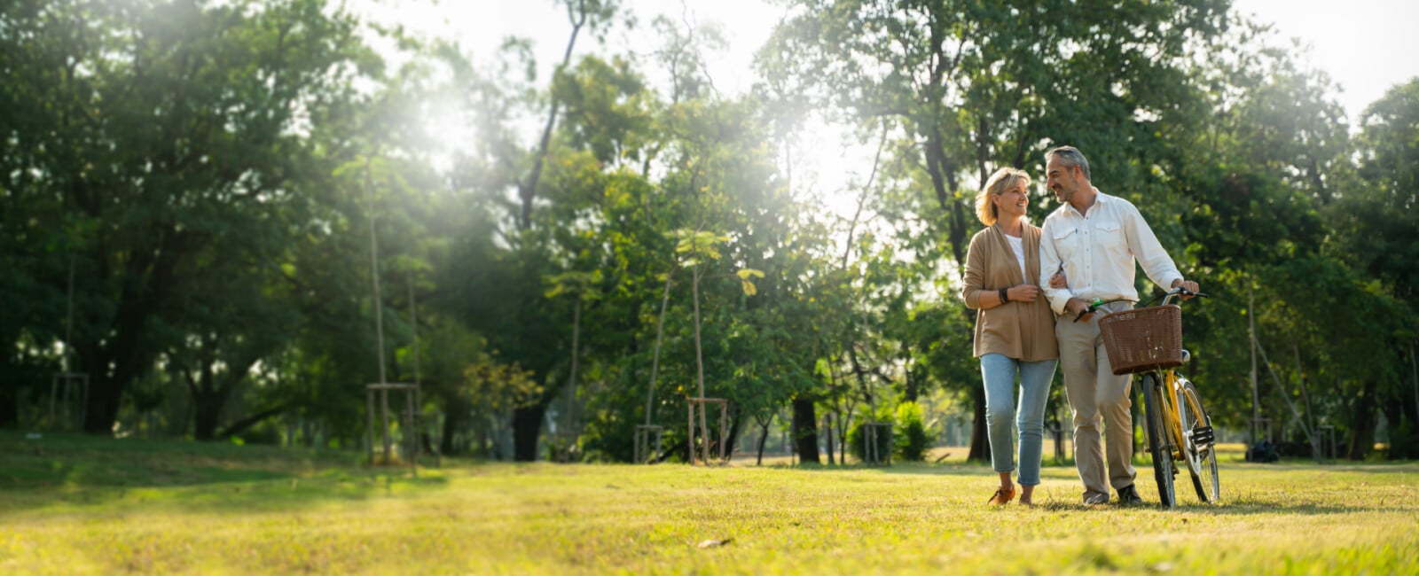 couple happily walking together in a field