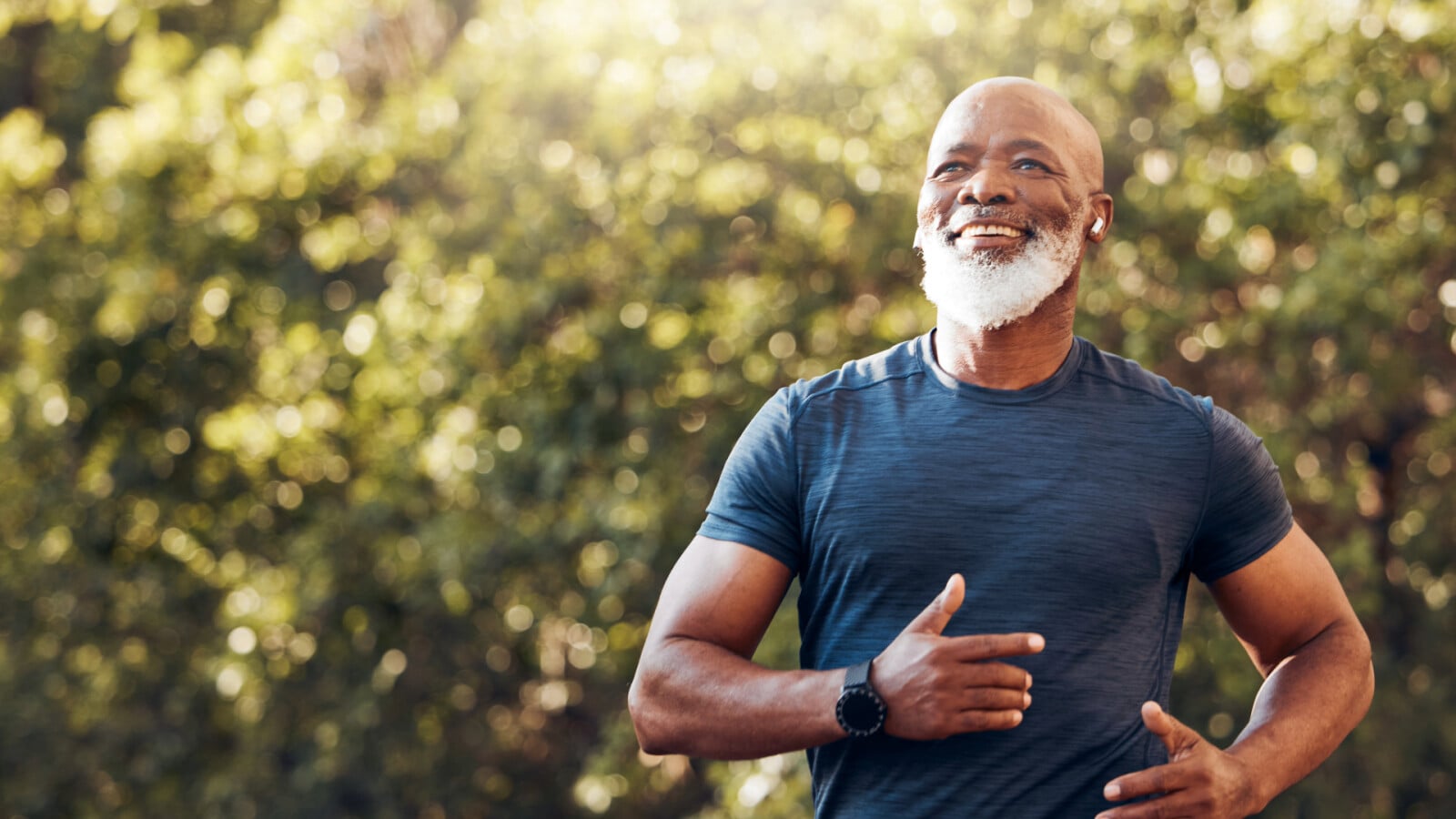man running and smiling listening to music