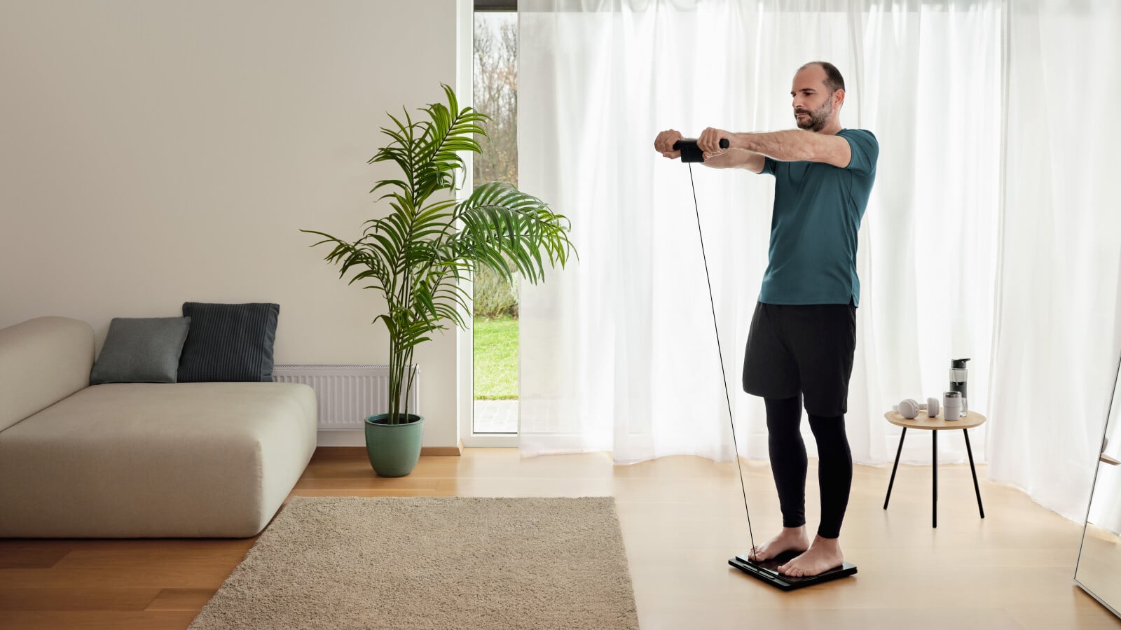Man using the body composition monitor standing on the scale