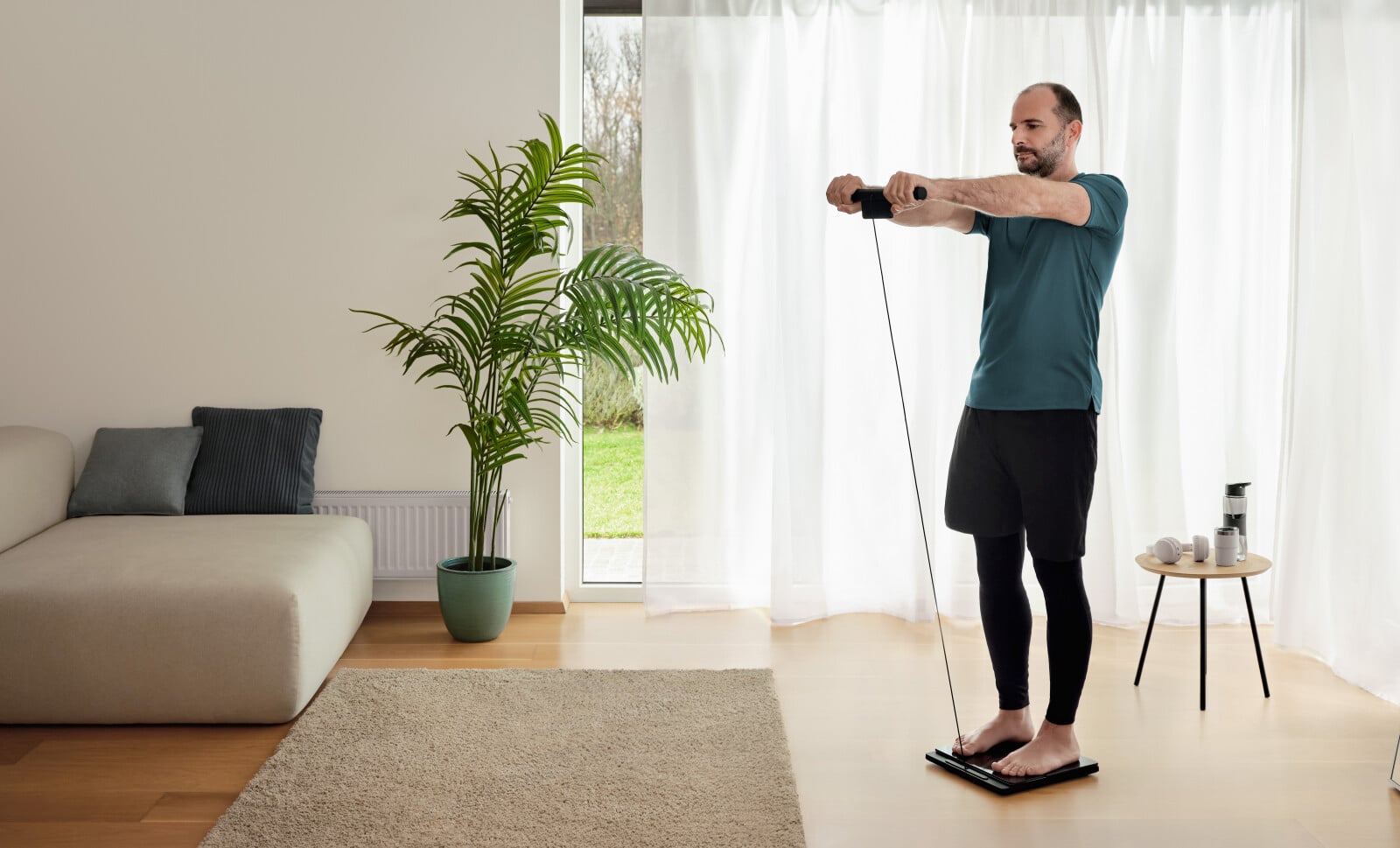 Man using the body composition monitor standing on the scale