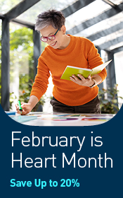 Woman standing, holding notebook and writing on desk. February is Heart Month. Save up to 20% off.